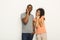 Young black couple on white studio background