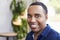 Young black male business owner at a coffee shop, portrait