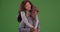 Young black man carries his girlfriend on green screen