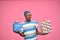 young black man feeling excited while holding gift boxes in both hands