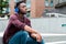 Young black man listening to musi with blue headphones
