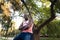 A young black man in park. Outdoor portrait of traveler. Portrait of a young african man outdoors. Outdoors portrait concept