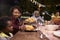 Young black mother serving her son food at a family barbecue