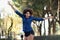 Young black woman with afro hairstyle jumping in urban background