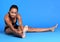 Young black woman hamstring stretch exercise