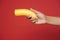 Young black woman wearing green sweater posing with banana