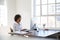 Young black woman working at computer in an office