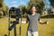 A young blogger records a video blog in a park on a sunny day. Freelancer, consulting, training, business. Distance lifestyle