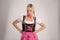 Young blond angry woman with dirndl costume
