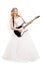 Young blond bride playing electric guitar