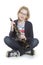 Young blond girl sits and holds clarinet in studio