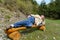 Young blond man laying on his side