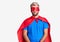 Young blond man wearing super hero custome depressed and worry for distress, crying angry and afraid