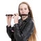 Young blond teen girl and piccolo flute in studio against white background