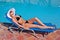 Young blond white woman on sunbed