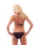 Young blond woman in black bikini from back