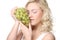 Young blond woman with grape