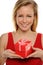 Young Blond Woman Holding a valentine gift