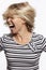 Young blond woman in jeans screaming. White background. Vertical