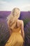 Young blond woman in lavender field Happy carefree AI generated