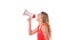 Young blond woman shouting into a megaphone