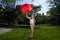 Young Blonde Athletic woman holding a Red Umbrella