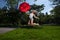 Young Blonde Athletic woman holding a Red Umbrella