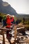 Young blonde caucasian hiker refreshing herself in High Tatras