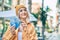 Young blonde girl smiling happy counting chilean pesos banknotes at the city