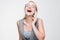 Young blonde laughing out loud talking on phone