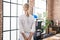 Young blonde woman business worker looking throw the window at office