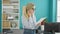 Young blonde woman business worker reading document at the office