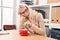 Young blonde woman business worker tired drinking coffee at office