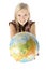 Young blonde woman with globe