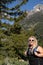 Young blonde woman hiker on the Bradley Lake trail wearing a backpack in Grand Teton National Park Wyoming