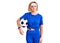 Young blonde woman holding soccer ball thinking attitude and sober expression looking self confident