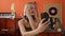 Young blonde woman musician make selfie by smartphone at music studio