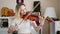 Young blonde woman musician playing violin at music studio