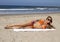 Young blonde woman vacationing at the beach