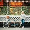 Young blonde woman on a vintage bicycle