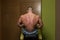 Young Bodybuilder Showing His Well Trained Back