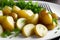 Young boiled potatoes with dill, parsley and onions