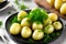 Young boiled potatoes with dill, parsley and onions