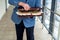 young boss businessman in expensive suit with tie holds suitcase with euro banknotes.