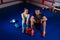 Young boxing couple sitting near lying boxing gloves and helmet