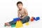 Young boy amongst building blocks