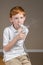 Young boy with asthma completing a breathing treatment