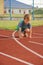 Young boy on athletic stadium