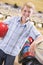 Young boy in bowling alley holding ball