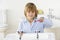 Young Boy Brushing Teeth at Sink